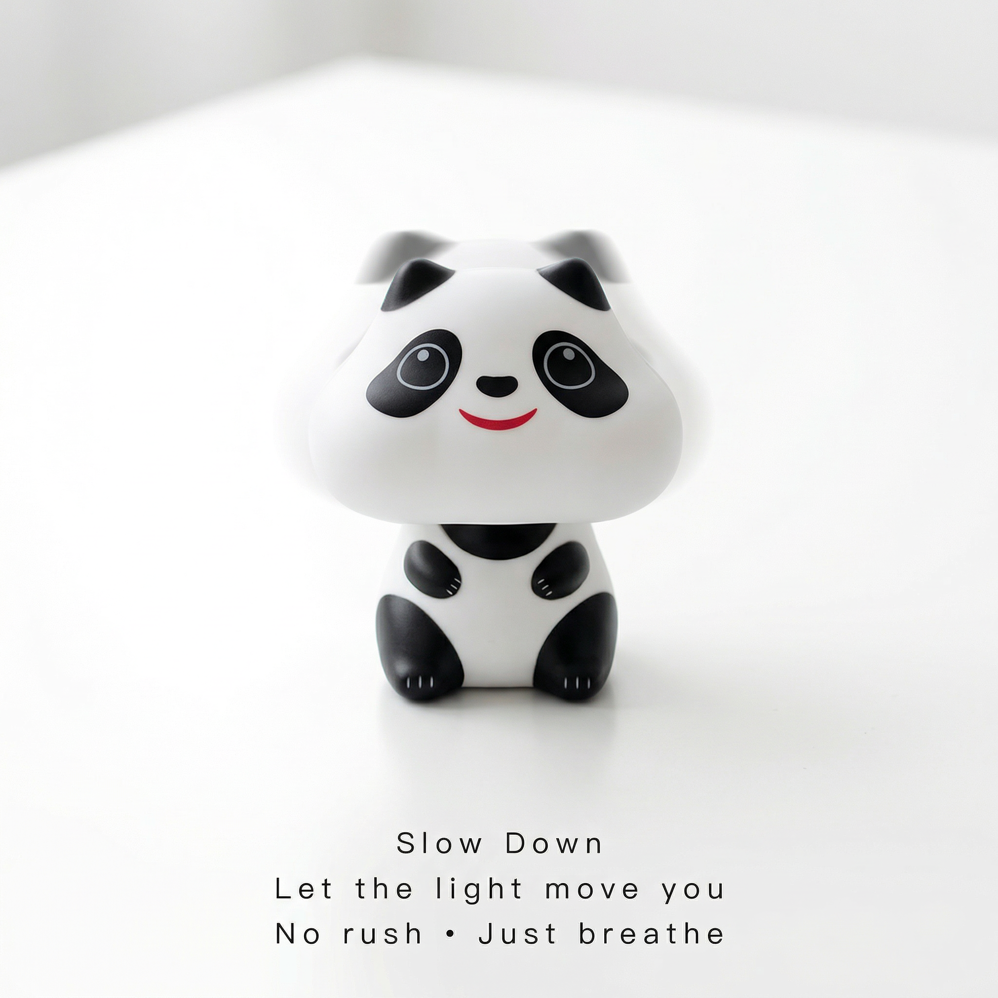 Solar panda desk companion front view on white background showing cute face and seated pose