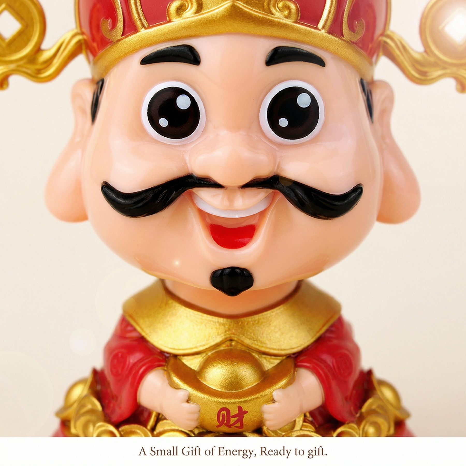 Close-up detail of chibi Caishen face holding a gold ingot on a solar desk figurine