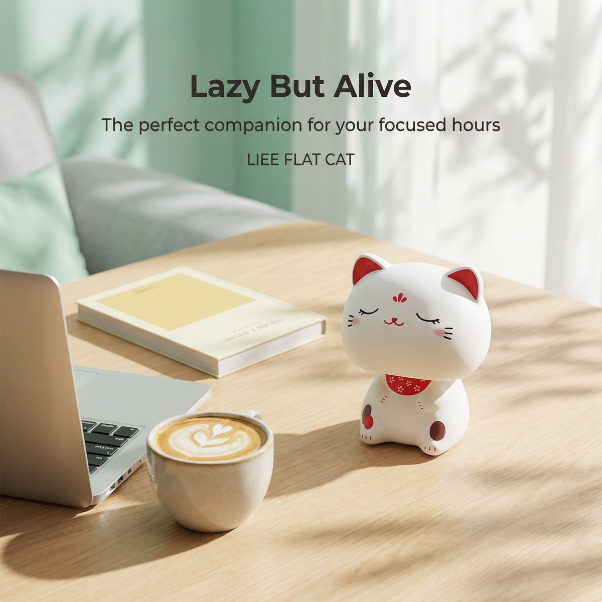 Big Head Solar Lucky Cat on desk with laptop and coffee - lazy but alive, perfect desk companion