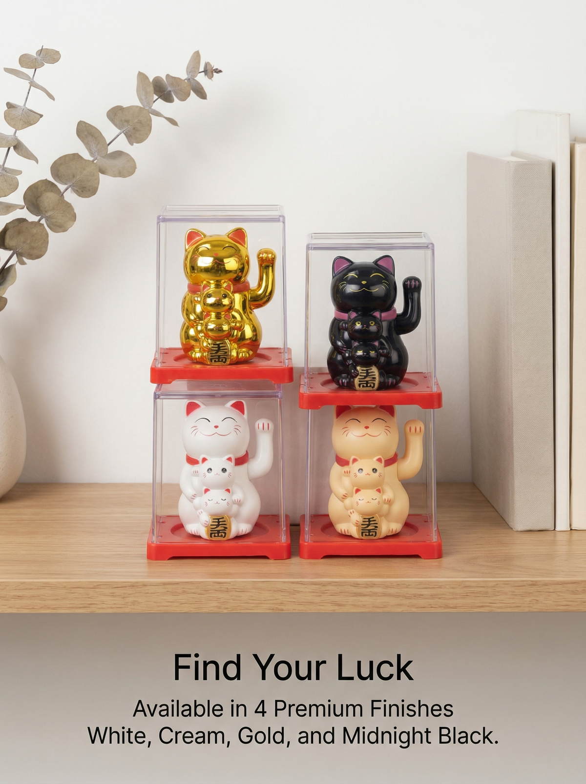 Four Smiley Solar Lucky Cat variants in premium display cases - White Cream Gold Black on bookshelf
